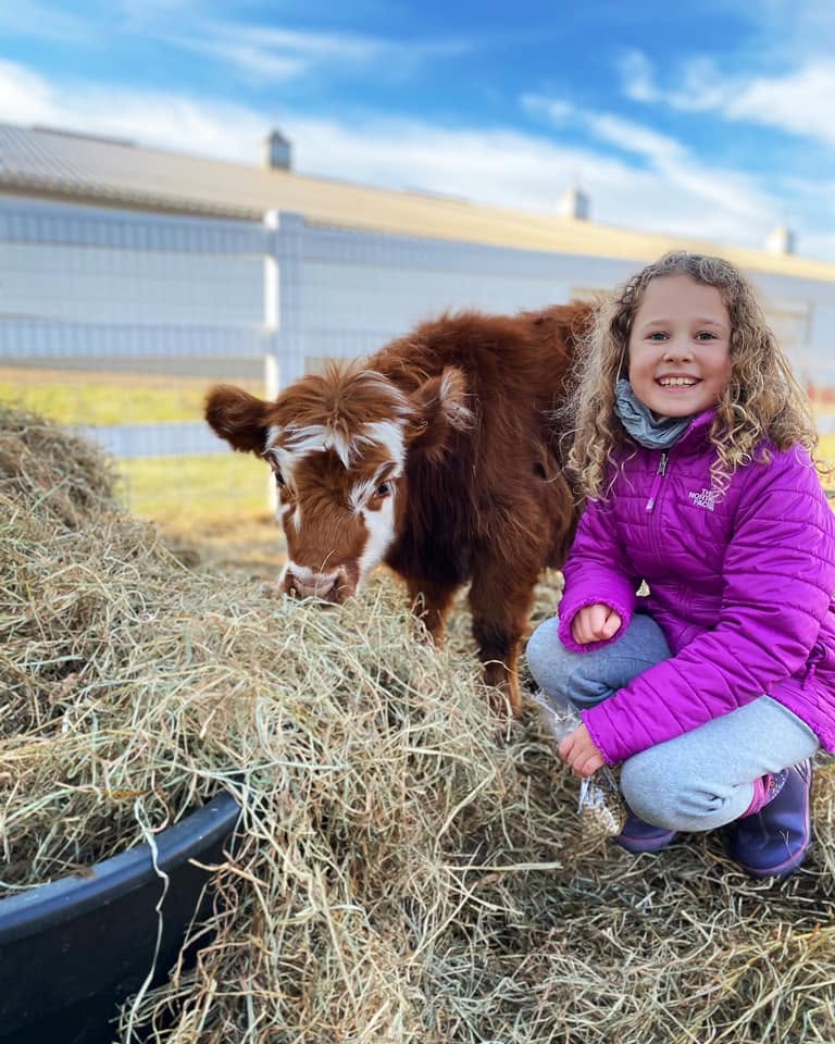 Becky and her kids at Eagle Eye Farm, December 2020
